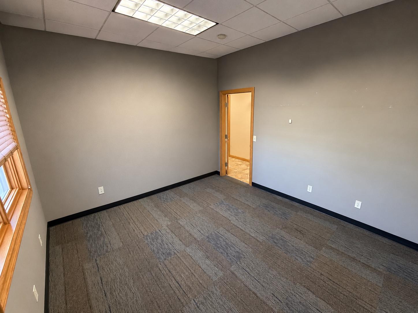 Suite 140 — private window office at Rochester Executive Suites, first floor of the 3265 building