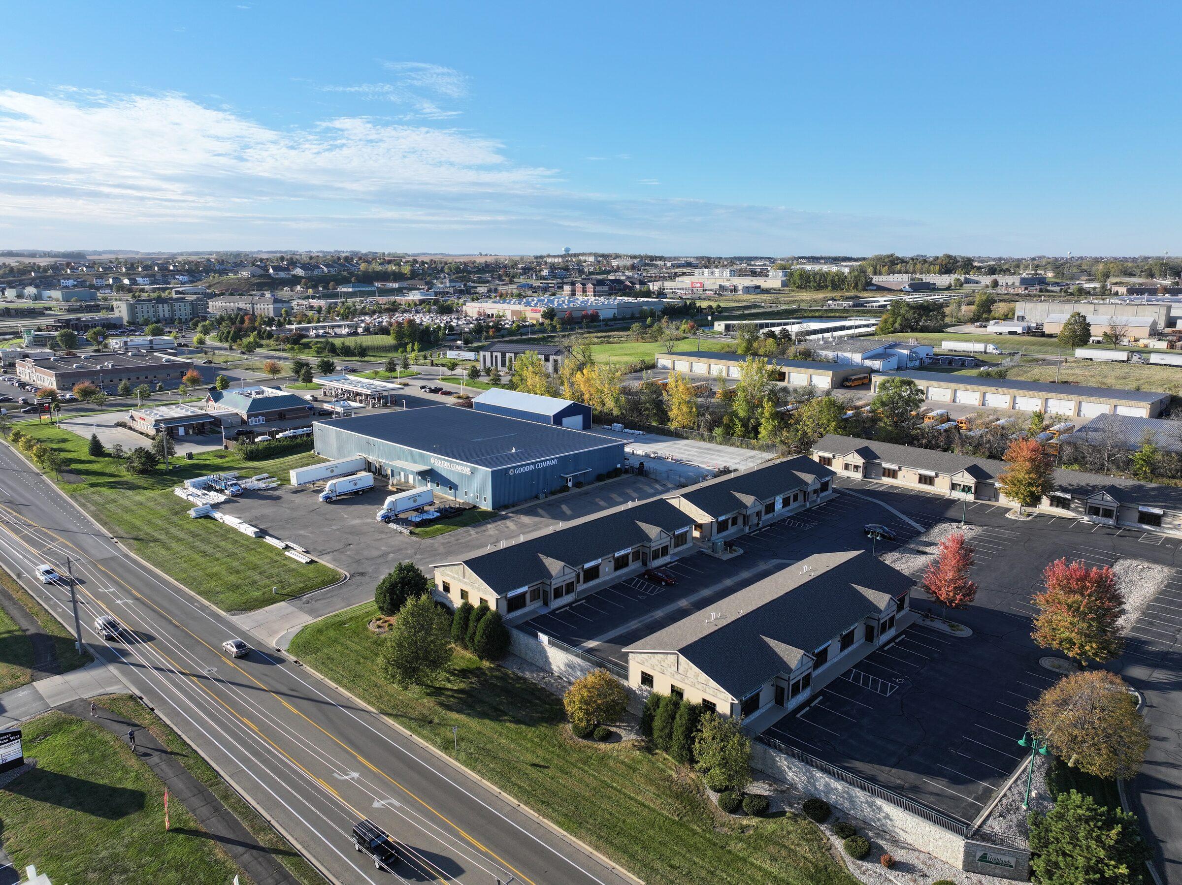 Aerial view of Rochester Executive Suites at golden hour, fall foliage